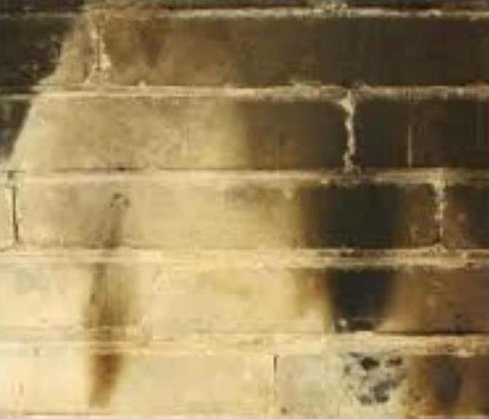 soot damage on brick wall