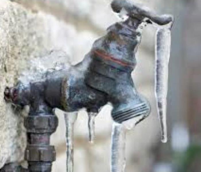 iced and frozen outdoor spigot